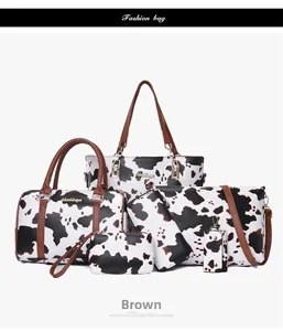 Detailed view of 6-piece brown cow print tote bag set including crossbody and clutch