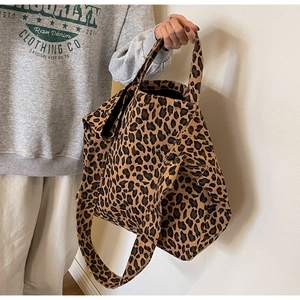 Detail of leopard print canvas tote bag with thick shoulder strap and large capacity