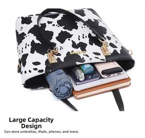 Internal view of cow print tote bag showing spacious storage for iPad and daily essentials