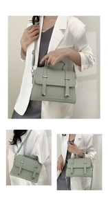 Detail of light green PU leather handbag featuring silver metal buckles and texture
