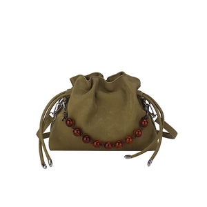 Olive green drawstring cloud bucket bag with amber beaded chain and leather strap