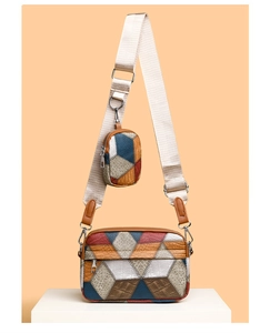Detail of color-block geometric crossbody bag with textured leather and wide strap