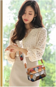 Detail of retro geometric patchwork crossbody bag with coin purse and woven strap