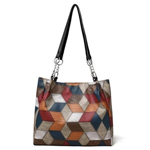 Large geometric patchwork tote bag with crocodile pattern and silver metal chain strap
