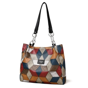 Large geometric patchwork tote bag with embossed texture and metal chain straps