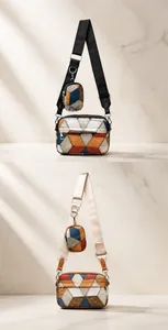 Detail view of colorful geometric patchwork crossbody bags with matching round coin purses
