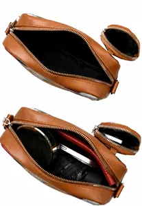 Detailed interior of a brown leather camera bag showing storage capacity and compartments