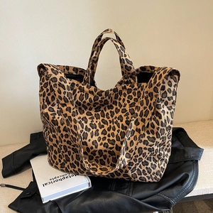Large leopard print canvas tote bag with dual handles and shoulder strap for women