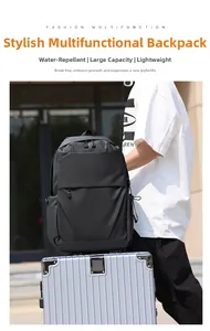 Close-up of black water-resistant laptop backpack on silver luggage for travel
