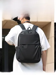 Close-up of minimalist black business backpack with waterproof fabric and wide straps