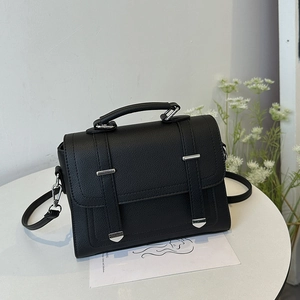 Chic black lychee texture handbag with silver metal accents and removable strap