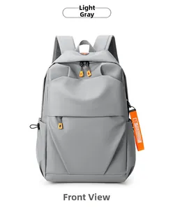 Front view of light grey water-resistant nylon backpack with vibrant orange zipper pulls