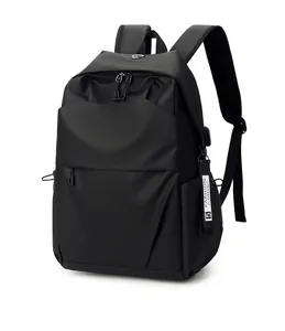 Detailed side view of black nylon backpack with fashion tag and multi-zipper pockets
