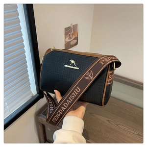 Detail of Boston bag with checkered embossing, wide fabric strap and golden hardware
