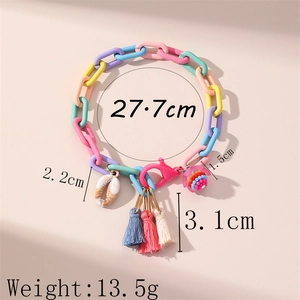 Handmade colorful acrylic chain anklet with tassel and shell pendant on pink background