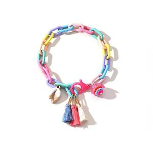 Colorful acrylic link anklet with seashell, turtle charm and tassel on white background