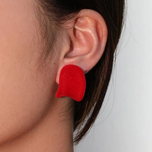 Close-up of red velvet animal stud earrings with s925 silver needle on model ear