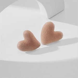 Detailed view of matte nude pink flocked heart earrings with S925 silver needle studs