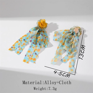 Detail view of long blue floral fabric tassel earrings with alloy studs and dimensions
