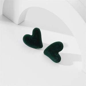 Detailed view of dark green velvet heart studs with soft flocking texture and S925 silver needles