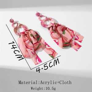 Detail view of pink floral chiffon tassel earrings with dimensions 14cm length and acrylic ring
