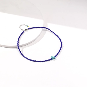 Detail of blue bead choker with starfish pendant and colorful adjustable extender chain
