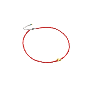 Red beaded choker necklace with a yellow starfish pendant and bohemian beach style details