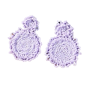 Handmade light purple seed bead circular drop earrings in a bohemian woven style