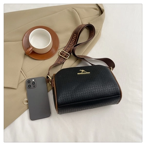 Detail of woven texture black leather Boston bag with kangaroo logo and bronze buckle