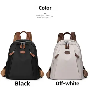 Side-by-side view of black and beige nylon backpacks with brown leather accents