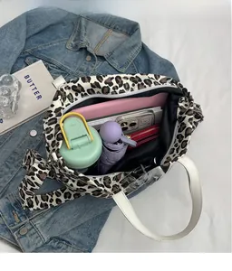 Spacious leopard print canvas tote bag interior showing ample storage for daily essentials