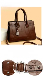 Detail of silver rivets and polished metal hardware on a dark brown textured tote bag