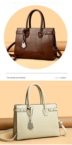 Detail view of stylish patchwork tote bags in dark brown and beige with metal charms