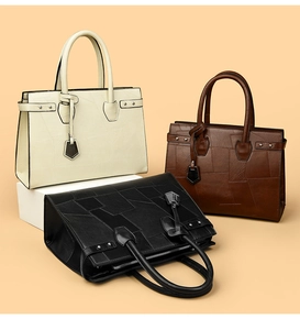 Detailed view of fashionable tote bags in off-white, dark brown, and black with geometric textures