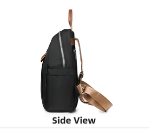 Side view of black waterproof nylon backpack with brown leather accents and side pocket