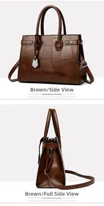 Detailed macro view showing brown textured patchwork leather surface of the tote bag
