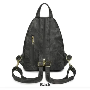 Vista trasera detallada de bolso bandolera retro de mezclilla con cremalleras doradas