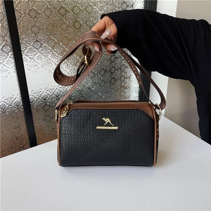 Women's Boston pillow bag with black woven texture, brown leather trim, and wide strap