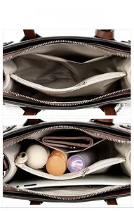 Detail view of large tote bag interior with multiple compartments and herringbone lining