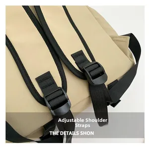 Close-up of adjustable shoulder straps with plastic buckles on beige nylon backpack