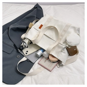 Large capacity white nylon tote bag showing internal storage for umbrella and cosmetics