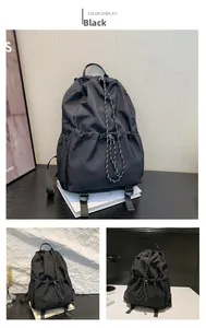 Detail of waterproof nylon drawstring backpack with textured ropes and side pockets