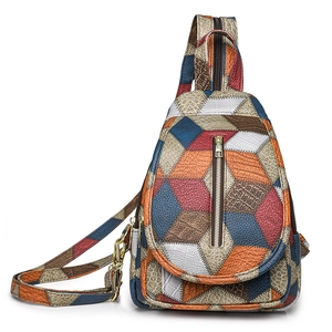 Multicolor patchwork leather sling bag with geometric pattern and front zipper pocket