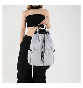 Detail showing high-density waterproof nylon fabric and adjustable black drawstring cords