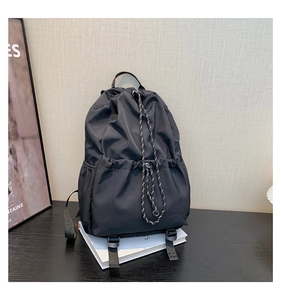 Detail of waterproof nylon drawstring backpack showing durable straps and buckle closure