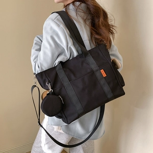 Large black casual tote bag for women with round coin purse and adjustable shoulder strap