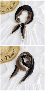 Close-up of diamond patchwork scarf with delicate lace edges and cotton linen texture