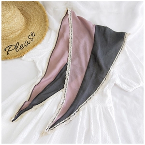 Detail view of pink and grey cotton linen scarf with delicate white lace trim edges