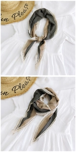 Detail of color-block cotton linen scarf with white lace trim and dark gray accents