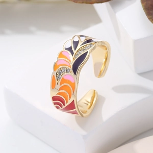 Detail of 18K gold-plated adjustable ring with colorful enamel inlay and sparkling zircons